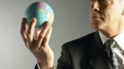 Business-Man-Holding-Globe-Business